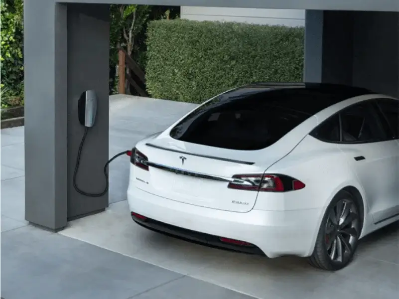 EV Charger Installation – Certified Installers in Bath Electric vehicle charging at home from a wall-mounted EV charger installed by Peaks Electrical in Bath.