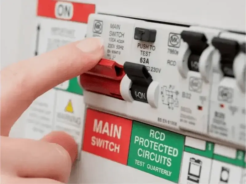 Fuse Board Upgrades – Peaks Electrical Bath Electrician switching on an RCD fuse board during a consumer unit upgrade in Bath.